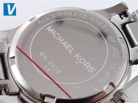 back of real and fake michael kors watch|michael kors watch look alike.